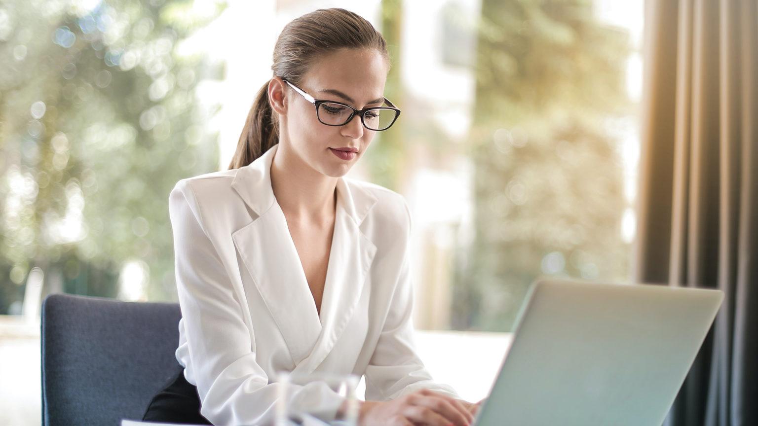 Professional working focused on a laptop